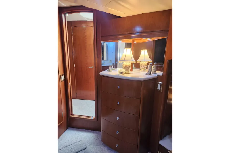 Slide: The Image of Luxurious interior of 1998 Carver 530 Voyager Pilothouse with elegant wooden cabinetry and lamp. - 42