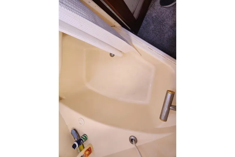 Slide: The Image of Shower area in 1998 Carver 530 Voyager Pilothouse with toiletries and handrail. - 43
