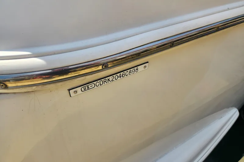 Slide: The Image of 1998 Carver 530 Voyager Pilothouse boat identification plate with serial number. - 48