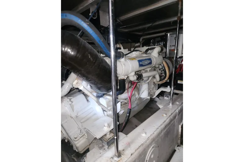Slide: The Image of Engine room of a 1998 Carver 530 Voyager Pilothouse yacht, showcasing mechanical components. - 50