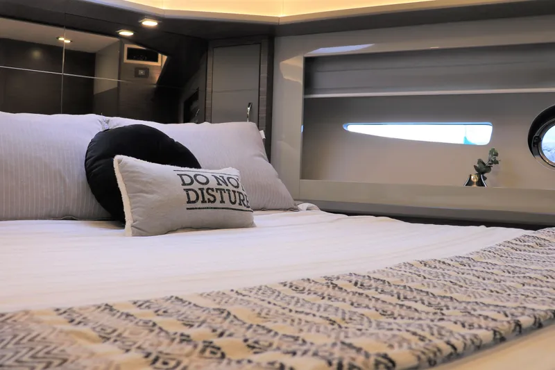 Slide: The Image of Luxurious interior of 2026 Cobrey 52 HT yacht with cozy bedding and decor. - 10
