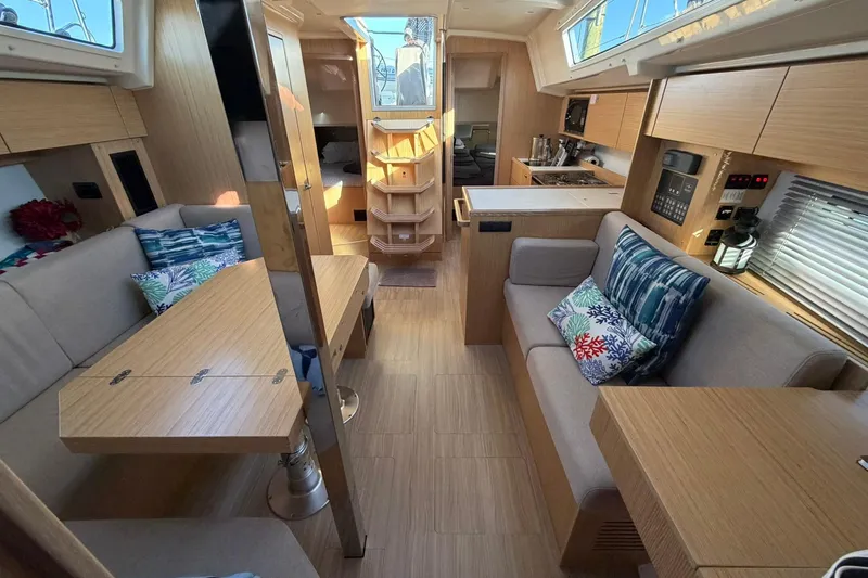 Slide: The Image of Modern interior of 2022 Bavaria C38 yacht with cozy seating and wooden finishes. - 1