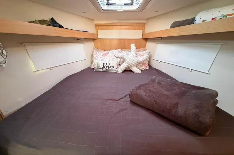 Slide: The Image of Cozy bedroom in 2022 Bavaria C38 yacht with plush bedding and decorative pillows. - 5