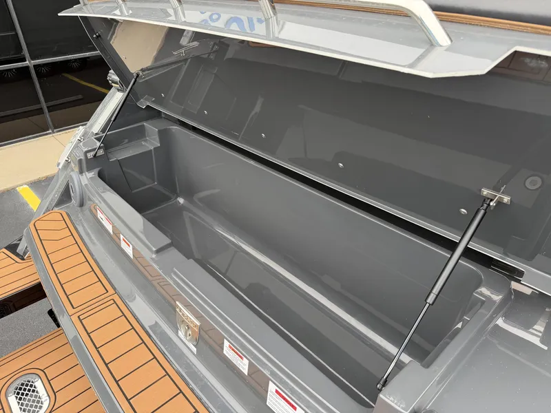 Slide: The Image of Open storage compartment of Cobalt R33 boat, model 2026. - 10