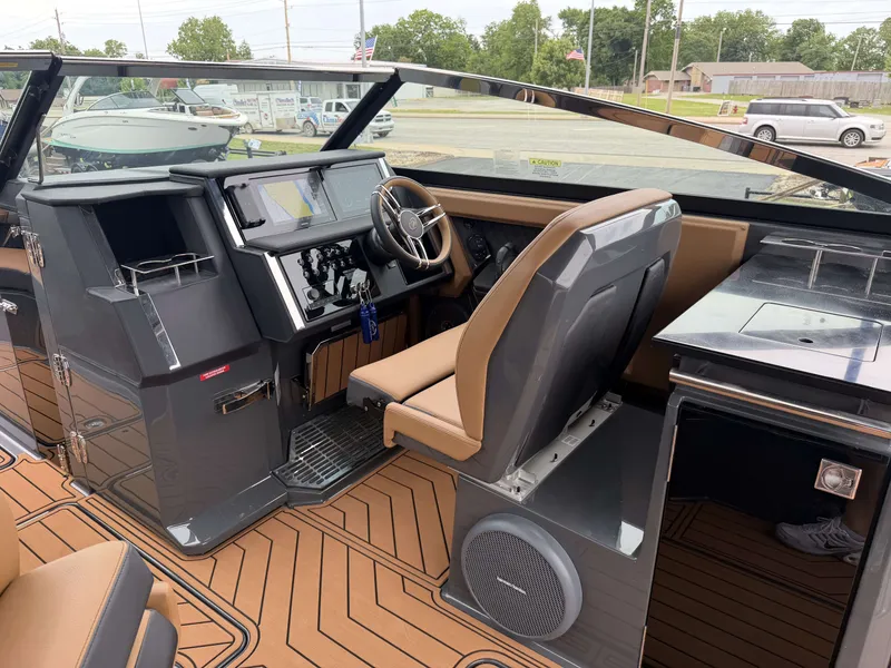 Slide: The Image of Interior of a 2026 Cobalt R33 boat featuring a modern cockpit. - 16