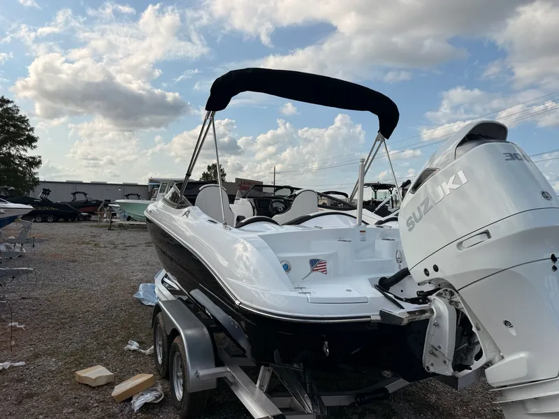 Slide: The Image of 2026 Stingray 23 OSX boat with Suzuki engine on trailer. - 17