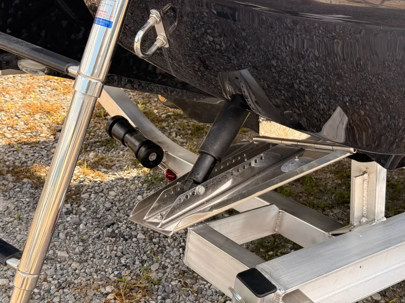 Slide: The Image of Stingray 23 OSX 2026 boat on trailer, close-up of stern. - 18