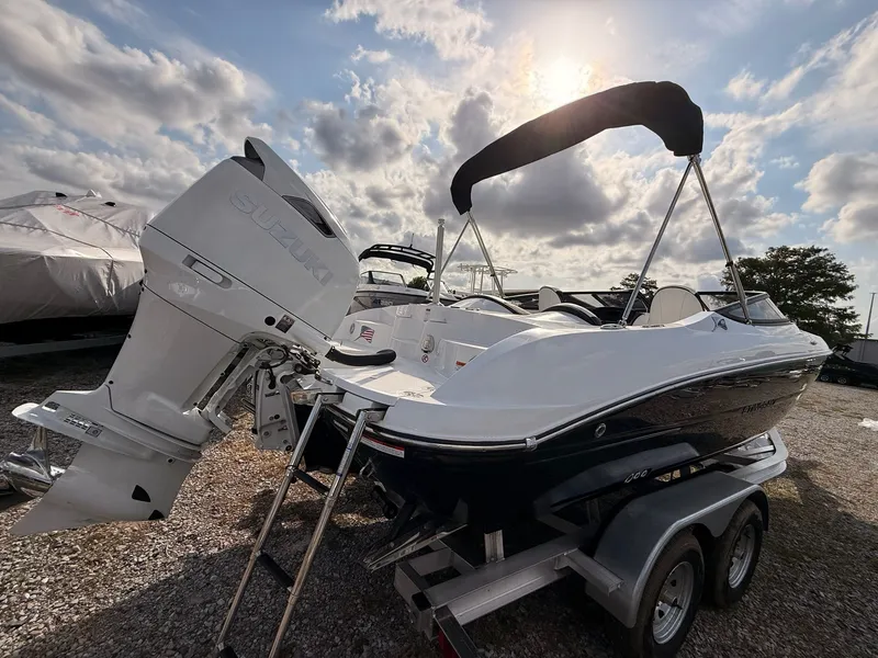 Slide: The Image of 2026 Stingray 23 OSX boat with Suzuki outboard motor. - 20