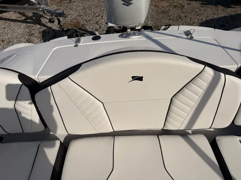 Slide: The Image of 2026 Stingray 23 OSX boat interior with white upholstery. - 24
