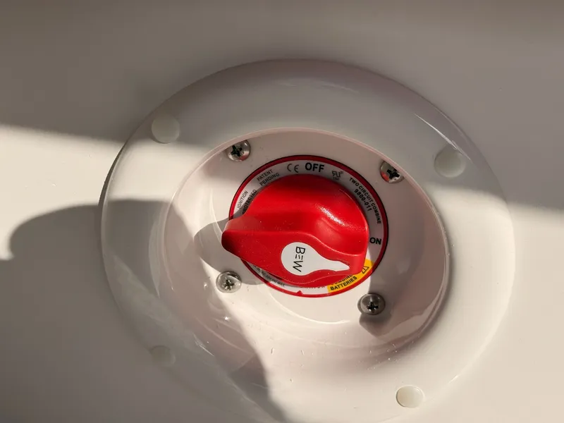 Slide: The Image of Red battery switch on 2026 Stingray 23 OSX boat. - 26