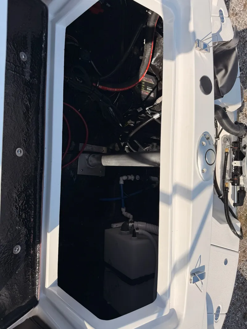 Slide: The Image of Interior view of a 2026 Stingray 23 OSX boat engine compartment. - 28