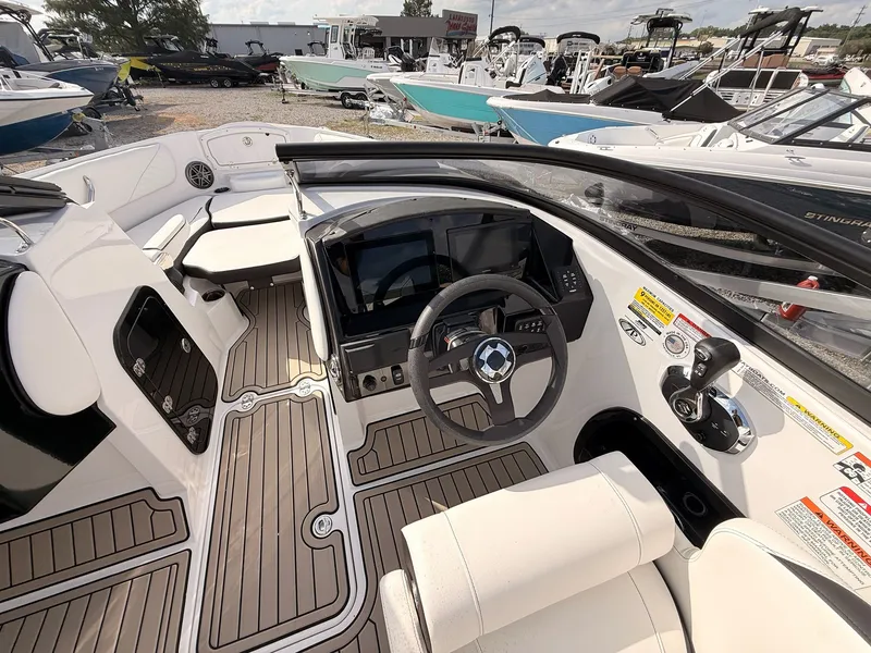 Slide: The Image of Interior of 2026 Stingray 23 OSX boat with modern features. - 33