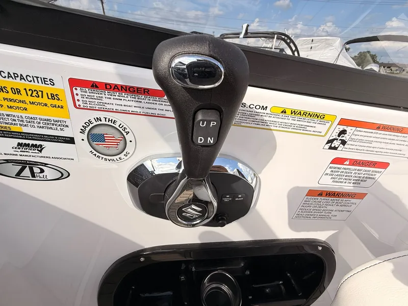 Slide: The Image of Close-up of Stingray 23 OSX boat throttle, model year 2026. - 35