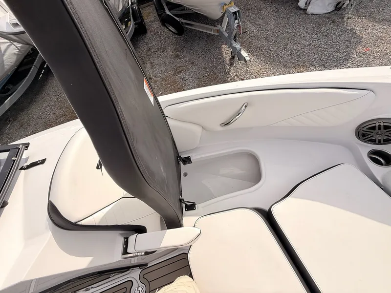 Slide: The Image of Interior of 2026 Stingray 23 OSX with seating area and speaker. - 36