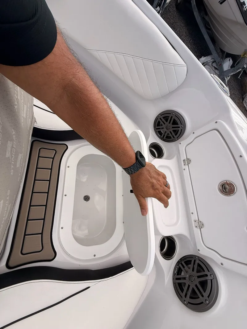 Slide: The Image of Interior of Stingray 23 OSX 2026 with speakers and armrest. - 41