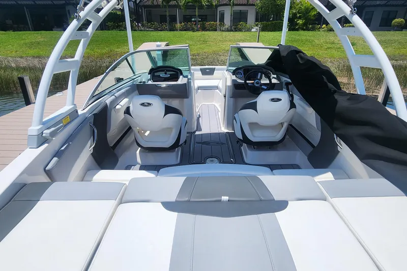 Slide: The Image of 2022 Chaparral 21 SSi OB boat interior with modern seating and dashboard design. - 15