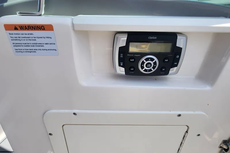 Slide: The Image of Control panel on 2022 Chaparral 21 SSi OB boat with warning label. - 28