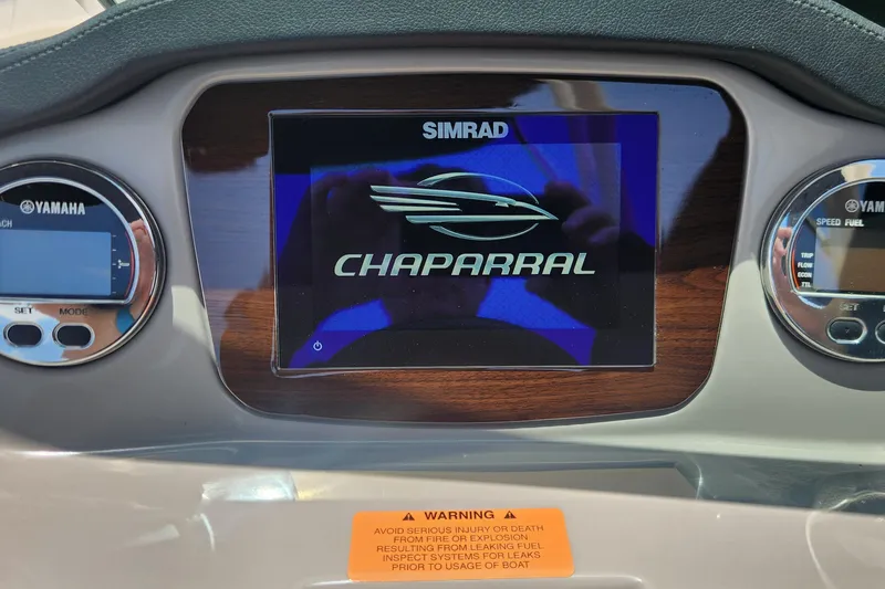 Slide: The Image of Dashboard of 2022 Chaparral 21 SSi OB boat with Simrad display and Yamaha gauges. - 34