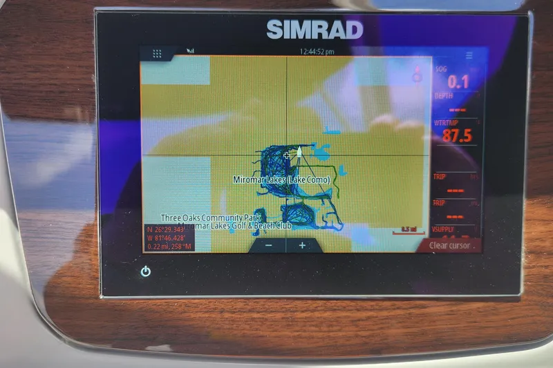 Slide: The Image of Simrad navigation display on 2022 Chaparral 21 SSi OB, showing Miromar Lakes map. - 38