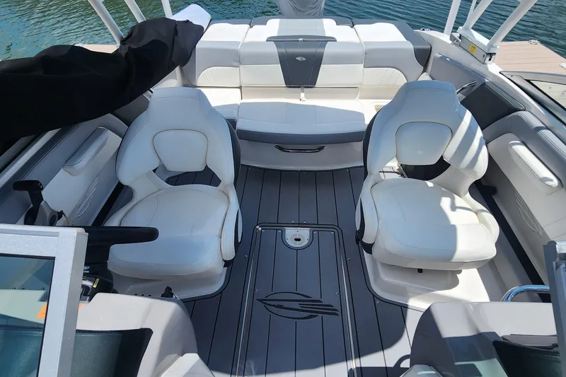 Slide: The Image of Interior view of 2022 Chaparral 21 SSi OB boat with white seating and sleek design. - 39