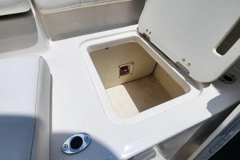 Slide: The Image of 2022 Chaparral 21 SSi OB boat storage compartment with open hatch. - 40