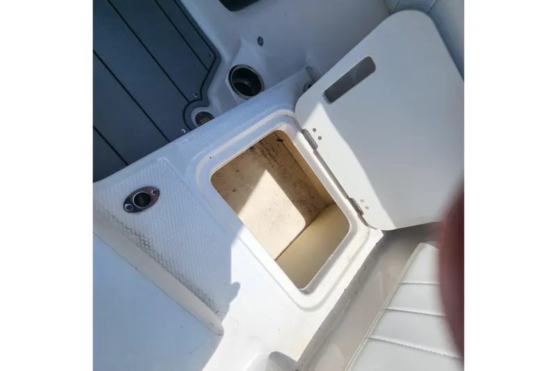 Slide: The Image of Open storage compartment on 2022 Chaparral 21 SSi OB boat interior. - 41