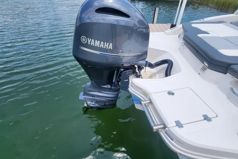 Slide: The Image of 2022 Chaparral 21 SSi OB with Yamaha outboard motor on calm water. - 49