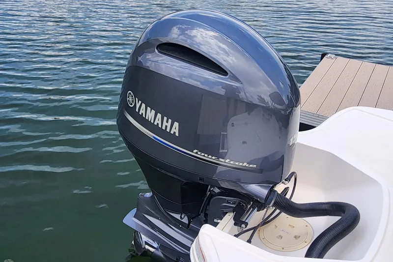 Slide: The Image of 2022 Chaparral 21 SSi OB with Yamaha outboard motor on a lake. - 50