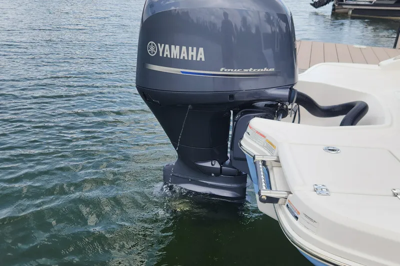Slide: The Image of 2022 Chaparral 21 SSi OB with Yamaha four-stroke outboard motor on water. - 57
