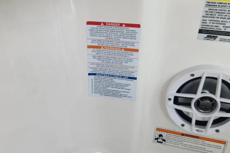 Slide: The Image of 2022 Chaparral 21 SSi OB warning labels and speaker detail. - 62