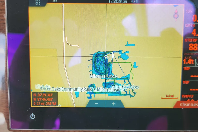 Slide: The Image of Boat navigation screen showing Miromar Lakes map on a 2022 Chaparral 21 SSi OB. - 67