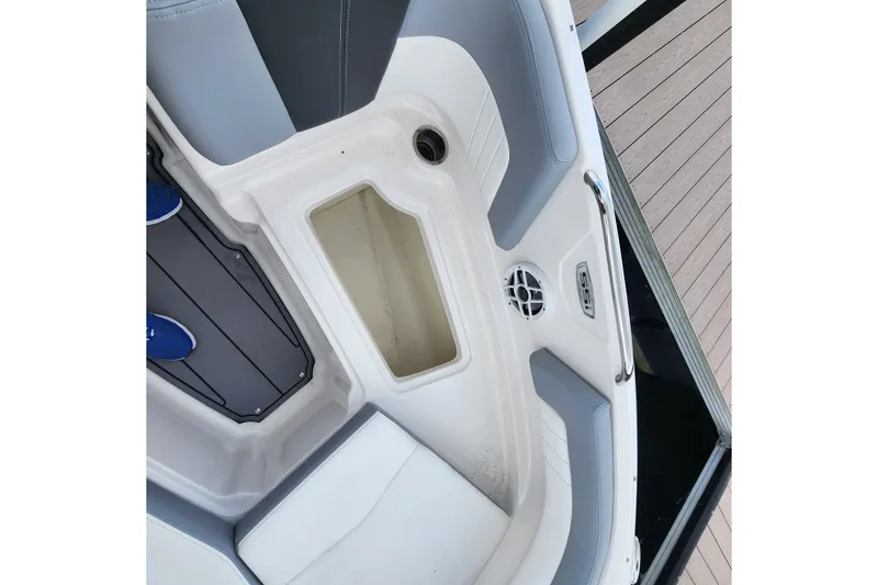 Slide: The Image of Interior view of 2022 Chaparral 21 SSi OB boat, featuring seating and storage area. - 73