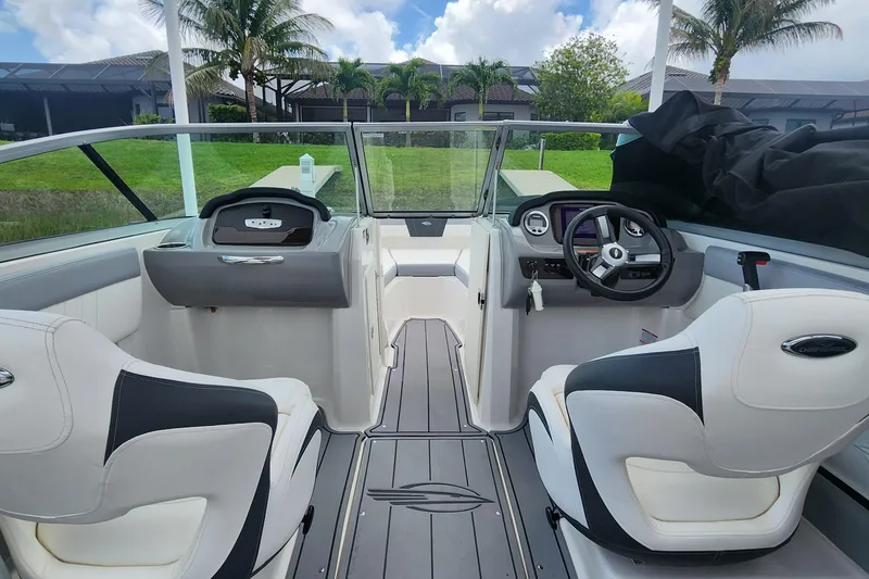 Slide: The Image of Interior view of 2022 Chaparral 21 SSi OB boat with modern dashboard and seating. - 76