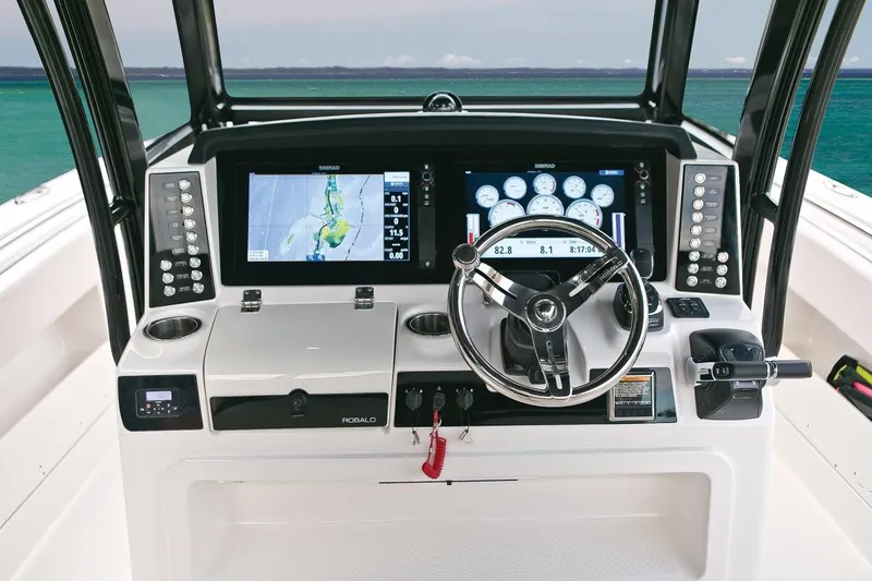 Slide: The Image of Manufacturer Provided Image: 2019 Robalo R302 Center Console helm with advanced navigation displays. - 5