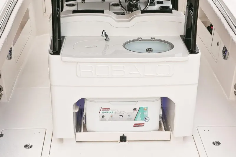 Slide: The Image of Manufacturer Provided Image: 2019 Robalo R302 Center Console boat interior with sink and storage. - 7