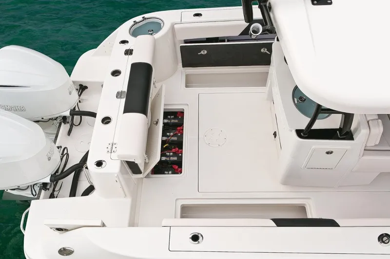 Slide: The Image of Manufacturer Provided Image: 2019 Robalo R302 Center Console boat deck with twin engines. - 8