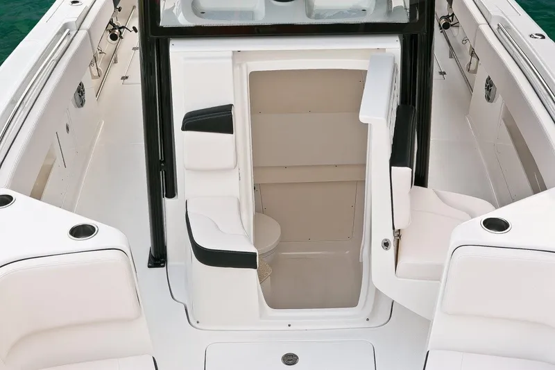 Slide: The Image of Manufacturer Provided Image: 2019 Robalo R302 Center Console boat interior with open console door. - 9