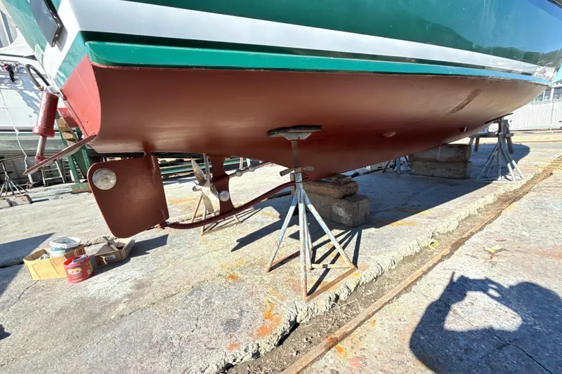 Slide: The Image of 1974 Dyer 29' Sport Fisher boat on stands, showing hull and propeller. - 17