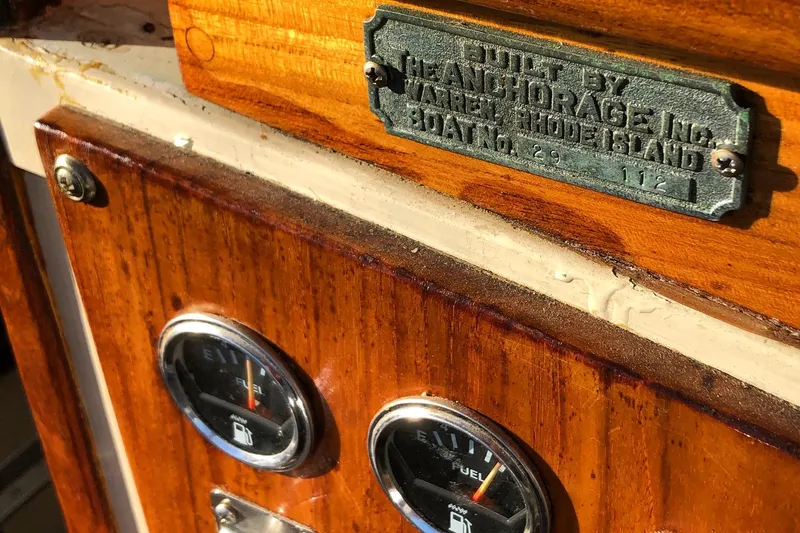 Slide: The Image of 1974 Dyer 29' Sport Fisher boat dashboard with fuel gauges and builder's plaque. - 21