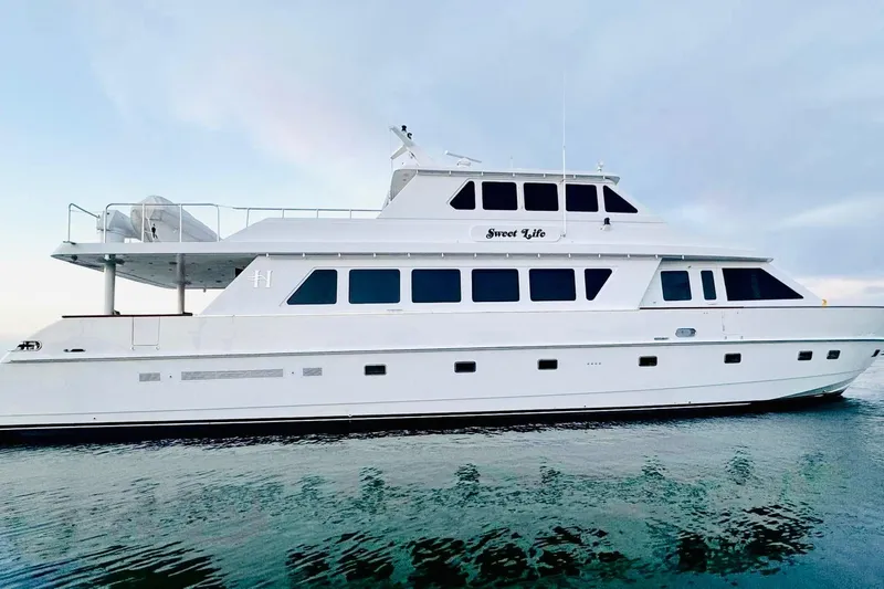 The Image of Luxurious 2001 Hargrave 94 yacht "Sweet Life" on calm waters under a clear sky. - 1