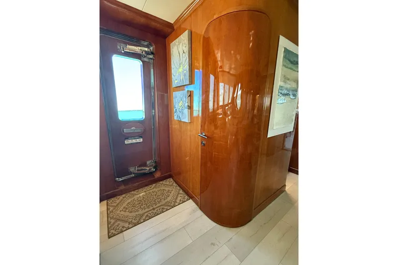 Slide: The Image of Luxurious wooden interior of a 2001 Hargrave 94 yacht with elegant artwork and polished finishes. - 21