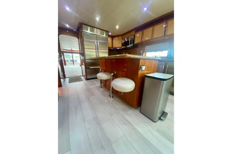 Slide: The Image of Luxurious kitchen interior of 2001 Hargrave 94 yacht with modern appliances and seating. - 24
