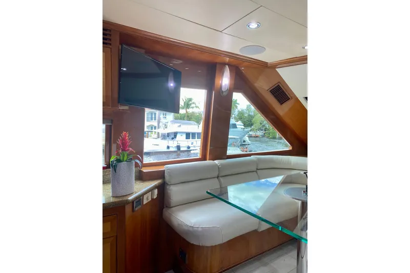 Slide: The Image of Luxurious interior of 2001 Hargrave 94 yacht with plush seating and waterfront view. - 30