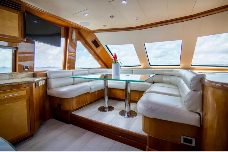 Slide: The Image of Luxurious interior of a 2001 Hargrave 94 yacht with plush seating and panoramic windows. - 31