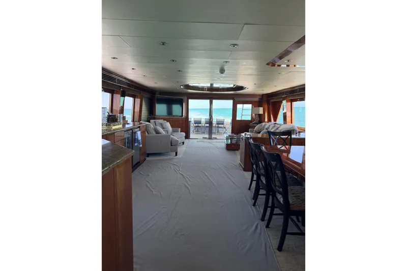 Slide: The Image of Luxurious interior of a 2001 Hargrave 94 yacht with ocean view and elegant furnishings. - 36