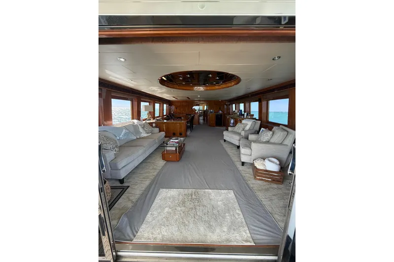 Slide: The Image of Luxurious interior of a 2001 Hargrave 94 yacht with elegant seating and ocean views. - 37