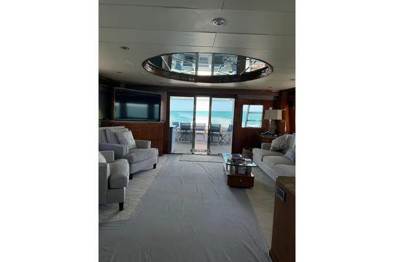 Slide: The Image of Luxurious interior of a 2001 Hargrave 94 yacht with ocean view through glass doors. - 39