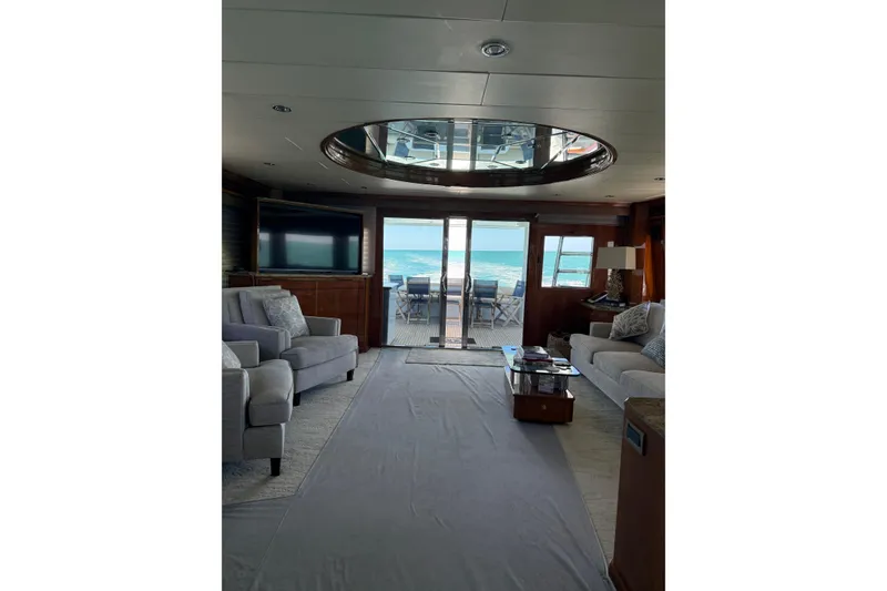 Slide: The Image of Luxurious interior of 2001 Hargrave 94 yacht with ocean view through glass doors. - 40