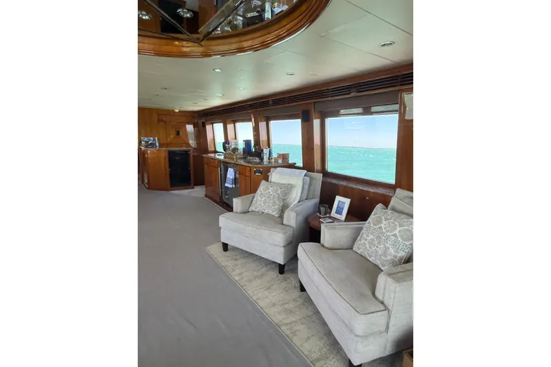 Slide: The Image of Luxurious interior of 2001 Hargrave 94 yacht with elegant seating and ocean view. - 41