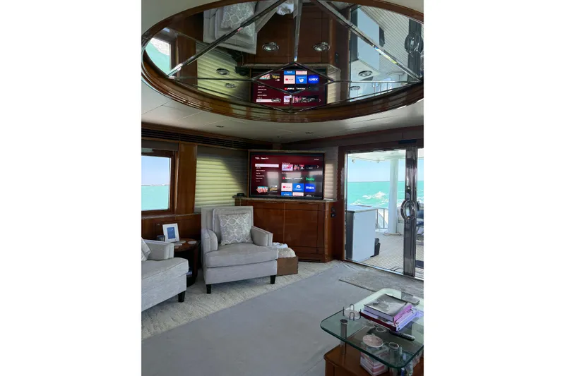 Slide: The Image of Luxurious interior of a 2001 Hargrave 94 yacht with elegant seating and ocean view. - 42